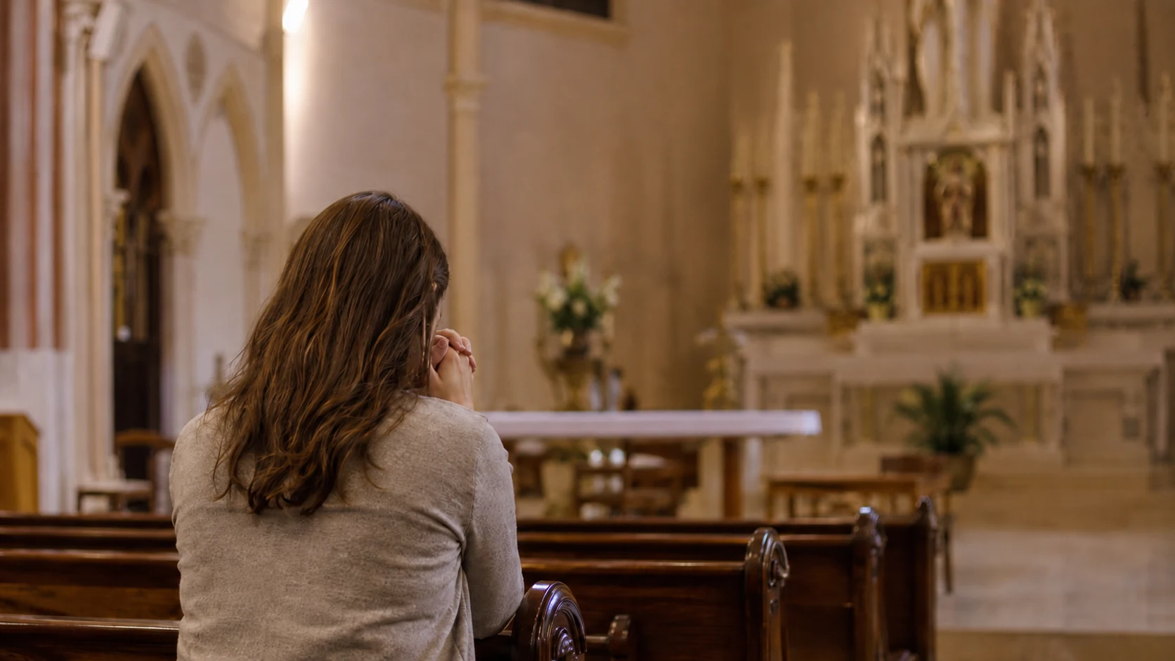 A woman praying in a church